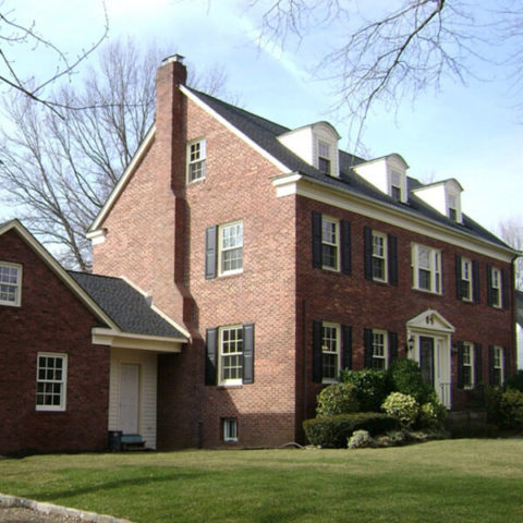 A brick house with glass windows in Huntington