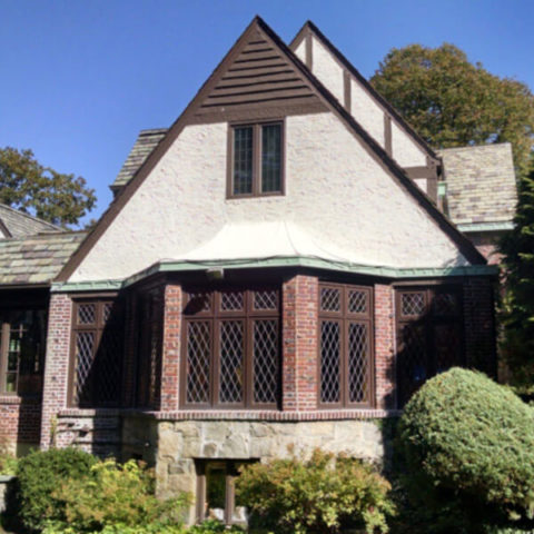 house with triangle shaped roof in cedarhurst